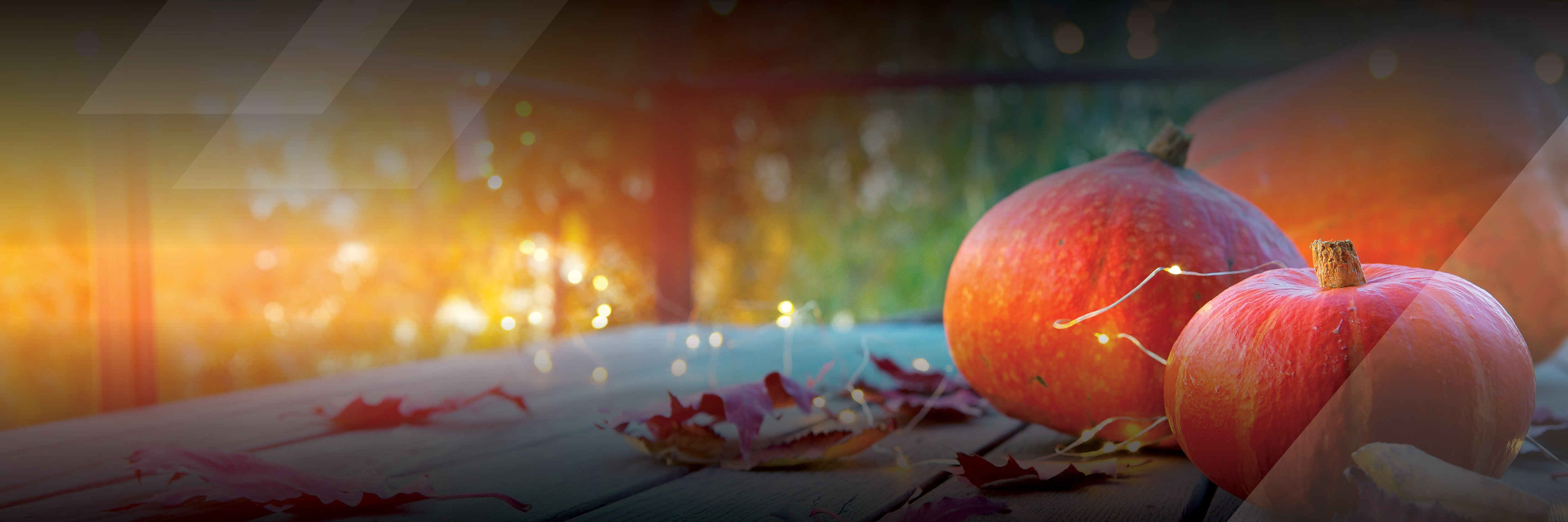 Pumpkins and fall leaves on a wooden table